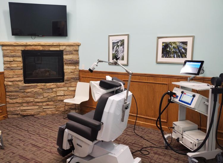 St. Louis TMS Therapy treatment room featuring a state-of-the-art Transcranial Magnetic Stimulation setup in a calming, patient-centered environment.